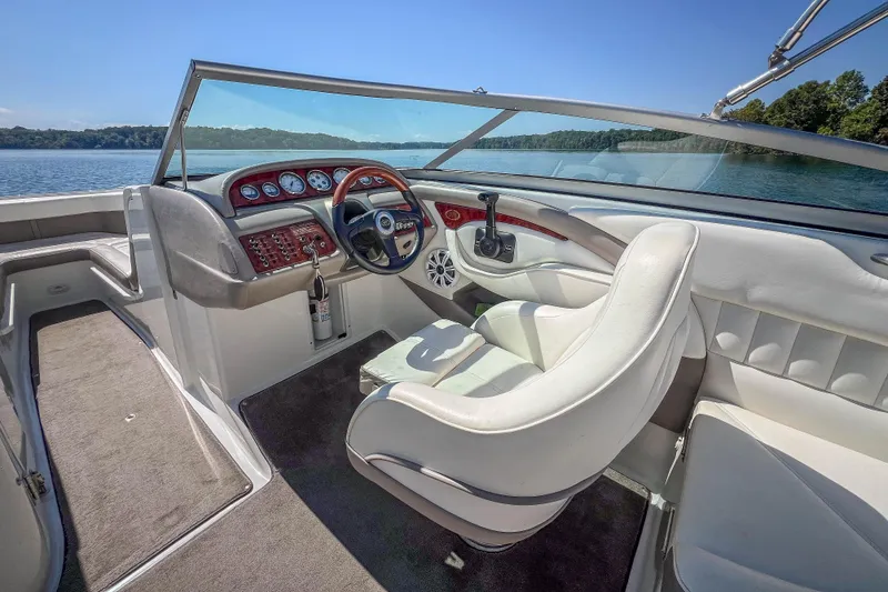 Slide: The Image of Interior of a 2003 Cobalt 240 boat with steering wheel and dashboard. - 20