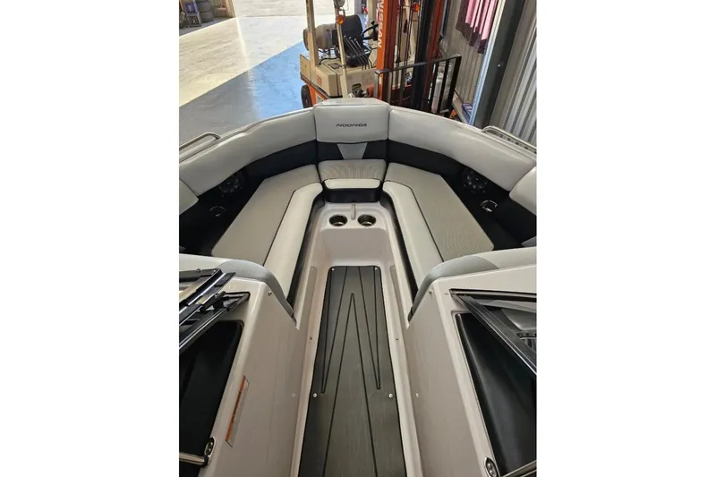 Slide: The Image of 2015 Moomba Mondo boat interior with gray seating and cup holders. - 10