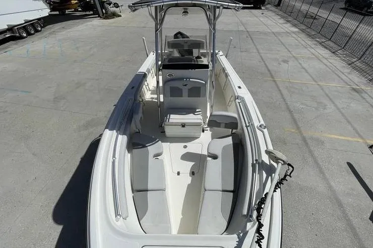 Slide: The Image of 2020 Mako 214 Center Console boat with spacious seating and modern design. - 18