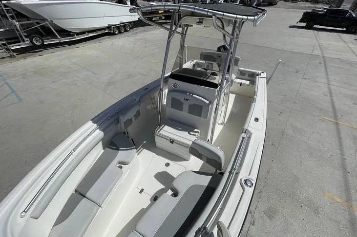 Slide: The Image of 2020 Mako 214 Center Console boat with spacious seating and modern design. - 19