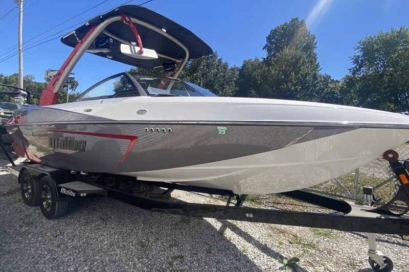 Slide: The Image of 2017 Malibu Wakesetter 23 LSV boat on trailer, parked outdoors. - 0