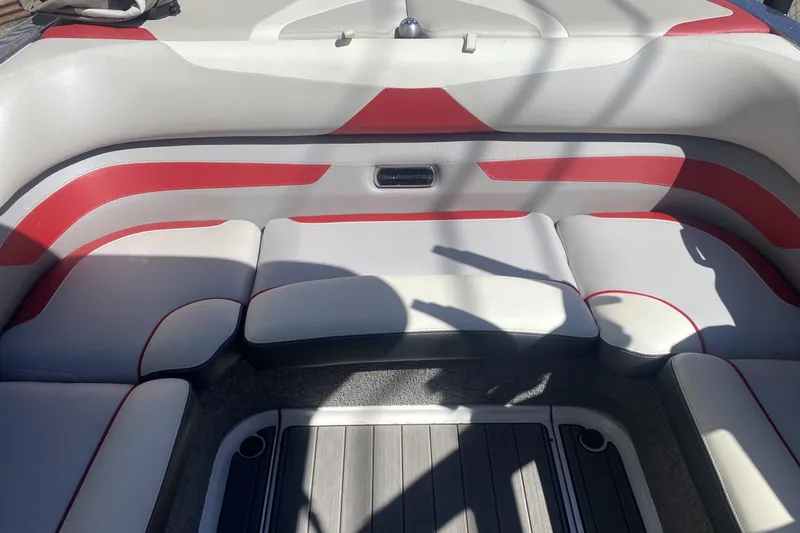 Slide: The Image of Interior seating of 2017 Malibu Wakesetter 23 LSV with red and white upholstery. - 2