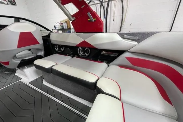 Slide: The Image of 2017 Malibu Wakesetter 23 LSV interior with red and white seating design. - 5