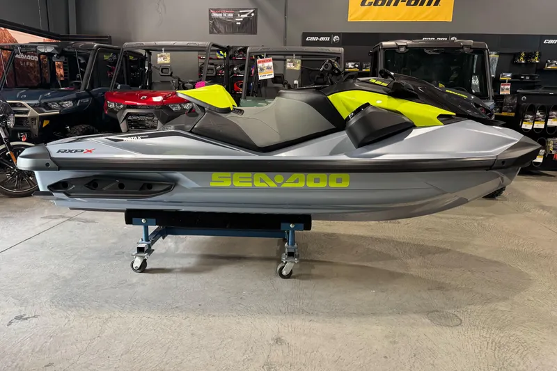 The Image of 2024 Sea-Doo RXP-X 325 jet ski in showroom, side view. - 1