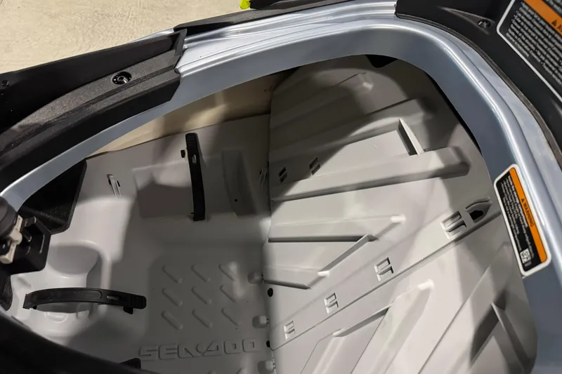 Slide: The Image of 2024 Sea-Doo RXP-X 325 storage compartment, showcasing interior design and space. - 10