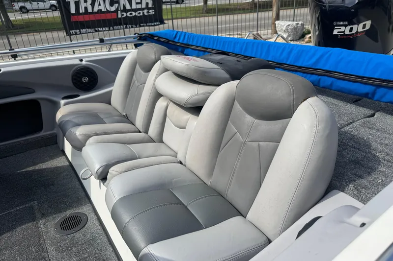 Slide: The Image of 2012 Skeeter SL210 boat interior with gray seating and Yamaha 200 engine. - 12