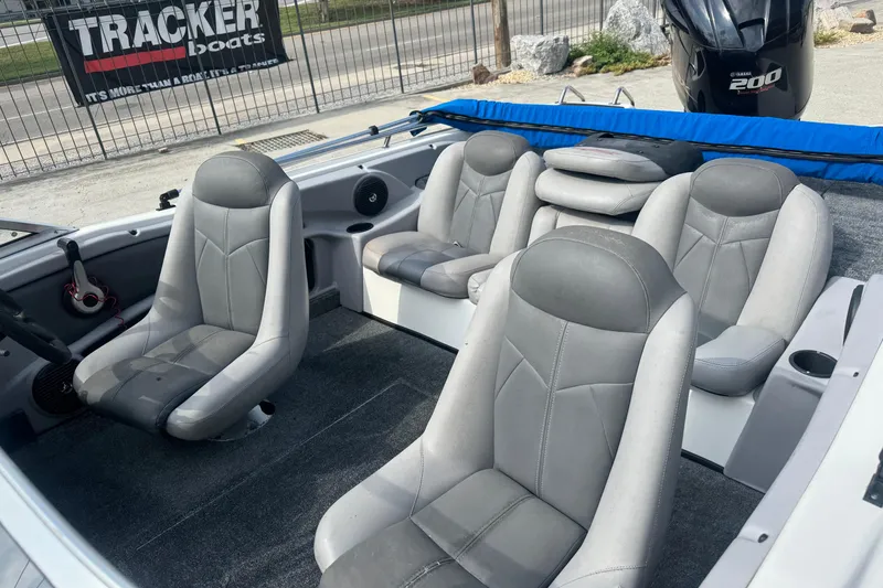 Slide: The Image of 2012 Skeeter SL210 boat interior with gray seating and Yamaha 200 engine. - 16