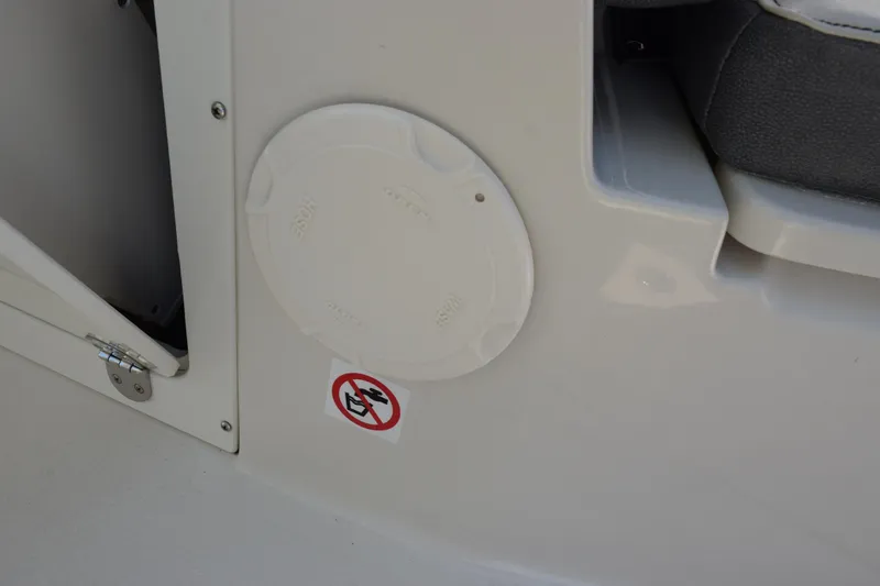 Slide: The Image of 2024 Stingray 216 CC boat interior detail with a no-smoking sign. - 21