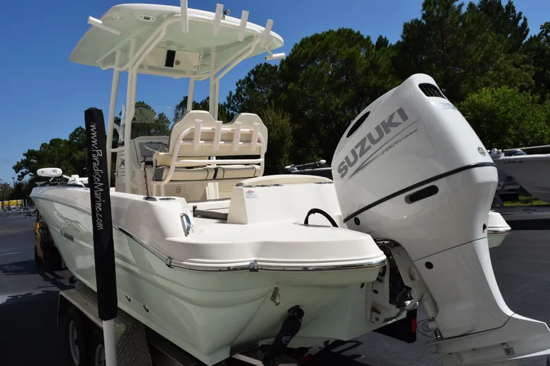 Slide: The Image of 2024 Stingray 216 CC boat with Suzuki outboard motor on a trailer. - 6