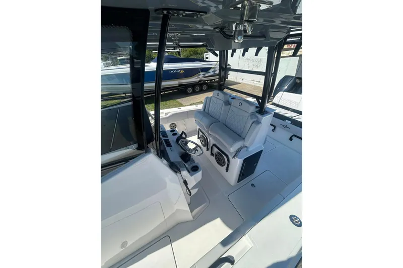 Slide: The Image of 2023 Fountain 38TE CC boat interior with storage compartments and speakers. - 18
