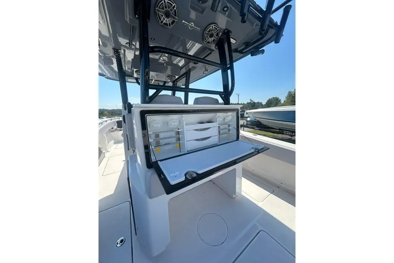 Slide: The Image of 2023 Fountain 38TE CC boat interior with fishing rod holders and seating. - 19