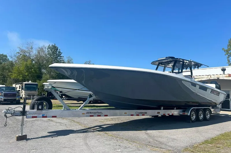 Slide: The Image of 2023 Fountain 38TE CC boat with triple outboard engines, rear view. - 8