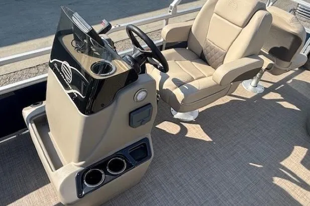 Slide: The Image of 2024 Sun Tracker Bass Buggy 18 DLX interior with steering console and seating. - 12