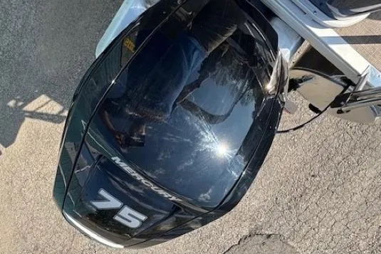 Slide: The Image of Outboard motor on a 2024 Sun Tracker Bass Buggy 18 DLX, featuring a 75 horsepower engine. - 22