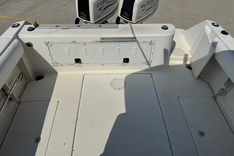 Slide: The Image of 1999 Hydra-Sports VECTOR 2650 WA boat deck with Evinrude engines in the background. - 15