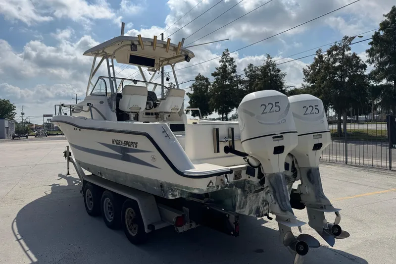 Slide: The Image of 1999 Hydra-Sports VECTOR 2650 WA boat on trailer with twin 225 horsepower engines. - 3