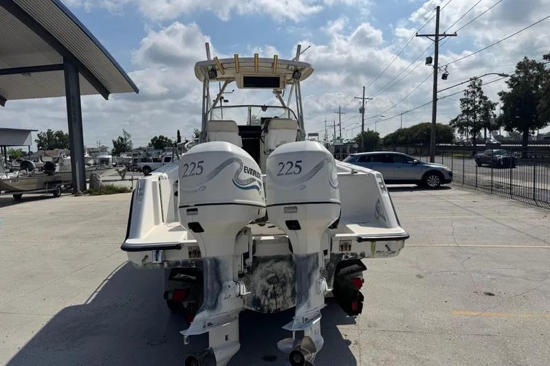 Slide: The Image of 1999 Hydra-Sports VECTOR 2650 WA boat with dual Evinrude 225 engines, parked outdoors. - 5
