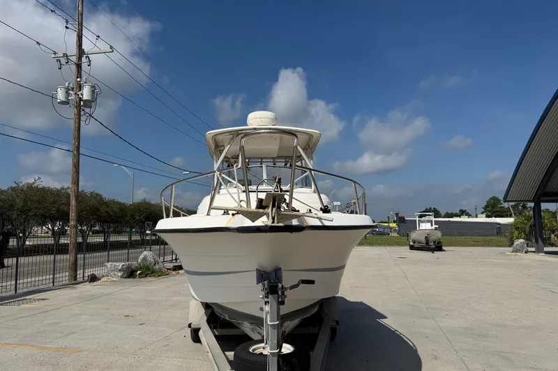 Slide: The Image of 1999 Hydra-Sports VECTOR 2650 WA boat on trailer under clear blue sky. - 8