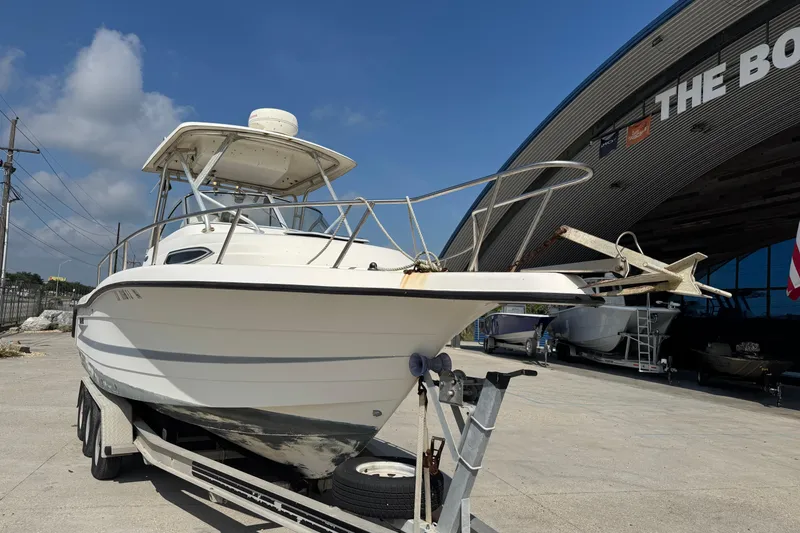 Slide: The Image of 1999 Hydra-Sports VECTOR 2650 WA boat on trailer outside a boat dealership. - 9