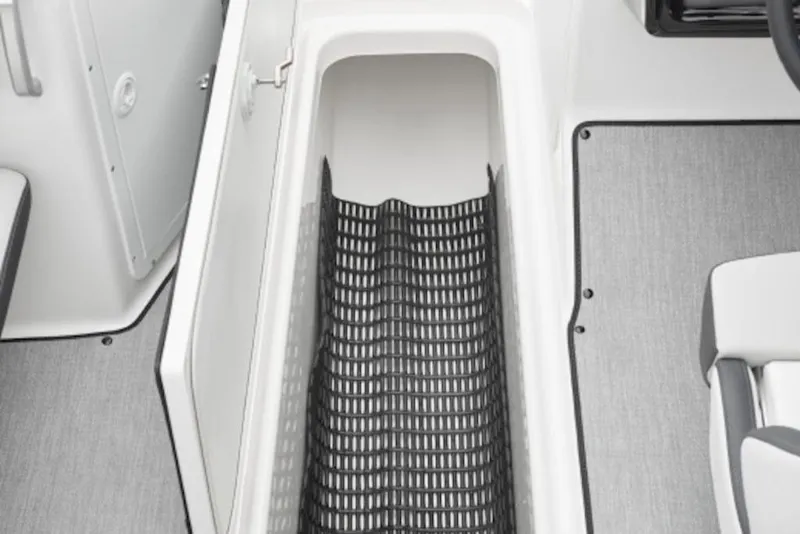 Slide: The Image of 2026 Yamaha Boats SX250 storage compartment with non-slip matting. - 3