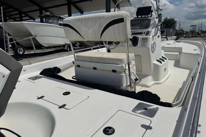 Slide: The Image of 2005 Bay Stealth 2230 boat interior with seating and control panel. - 11