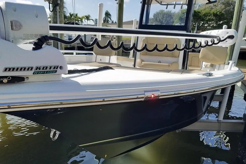 Slide: The Image of 2019 Sea Hunt BX 25 FS boat with Minn Kota Riptide trolling motor docked. - 0