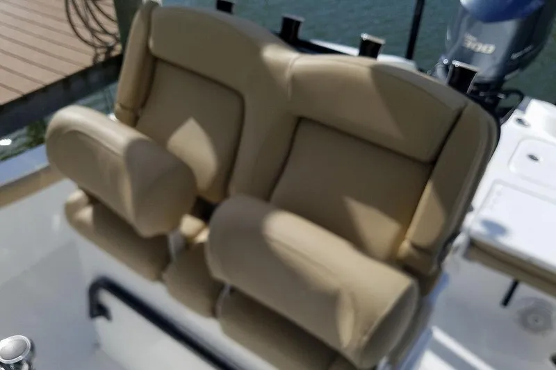 Slide: The Image of 2019 Sea Hunt BX 25 FS boat with beige cushioned seating. - 4