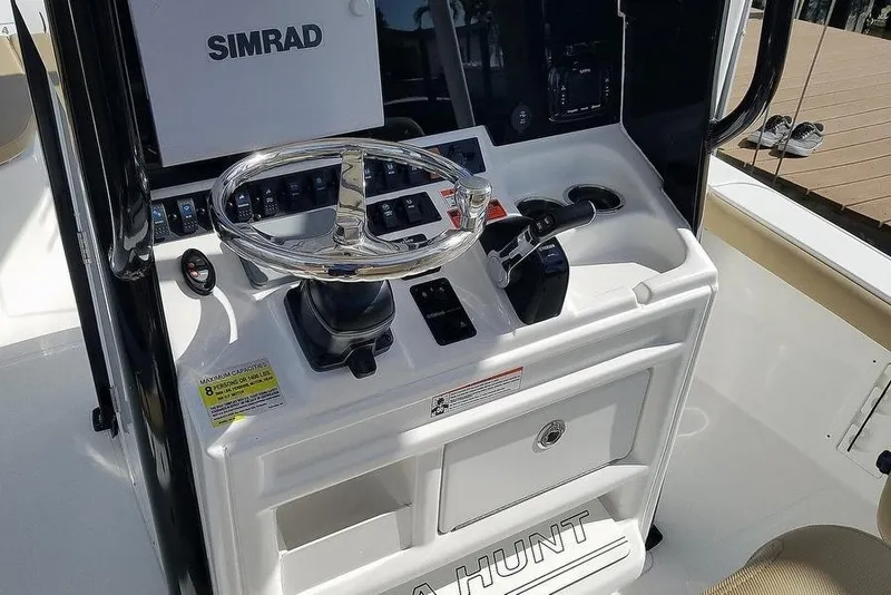 Slide: The Image of 2019 Sea Hunt BX 25 FS boat console with Simrad electronics and steering wheel. - 5