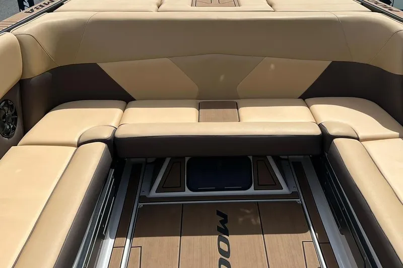 Slide: The Image of Luxurious seating in a 2020 Moomba Max boat, featuring tan and brown upholstery. - 3