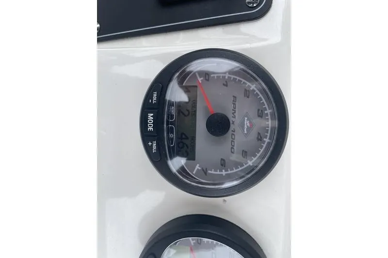 Slide: The Image of Close-up of 2012 Boston Whaler 250 Outrage tachometer displaying RPM and mode settings. - 10