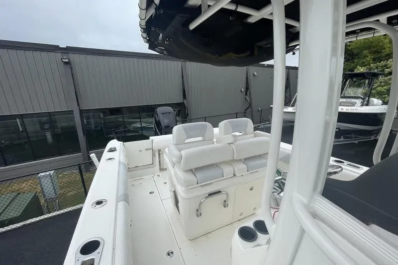 Slide: The Image of 2012 Boston Whaler 250 Outrage boat interior with seating and storage features. - 7