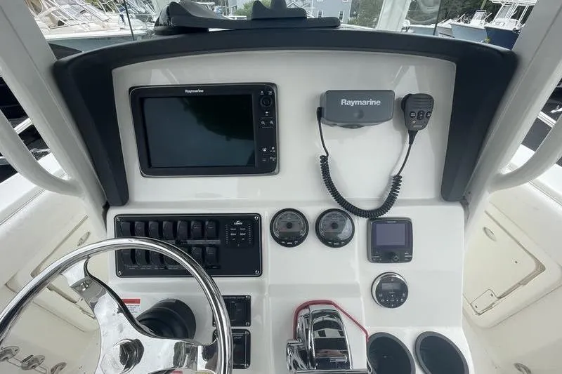 Slide: The Image of Control panel of a 2012 Boston Whaler 250 Outrage with Raymarine electronics. - 8