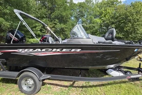 The Image of 2022 Tracker Pro Guide V-175 WT boat on trailer, parked outdoors. - 1