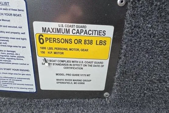 Slide: The Image of U.S. Coast Guard capacity label on 2022 Tracker Pro Guide V-175 WT boat. - 10