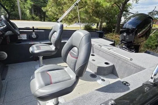 Slide: The Image of 2022 Tracker Pro Guide V-175 WT boat interior with seating and Mercury outboard motor. - 12