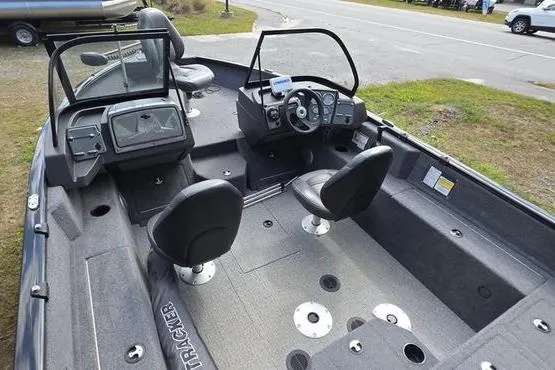Slide: The Image of 2022 Tracker Pro Guide V-175 WT boat interior with seating and control panel. - 16