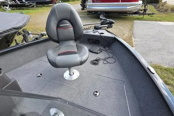 Slide: The Image of 2022 Tracker Pro Guide V-175 WT boat interior with swivel seat and trolling motor. - 8