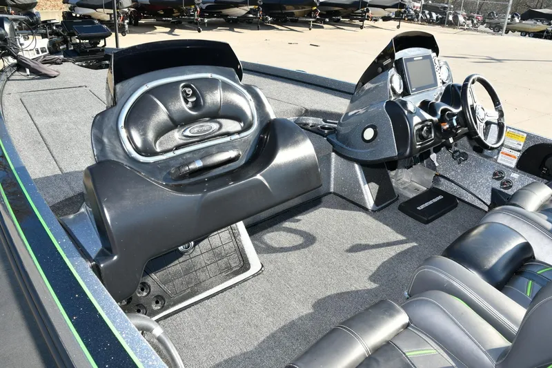Slide: The Image of 2020 Nitro Z21 Pro boat interior with steering console and seating. - 2
