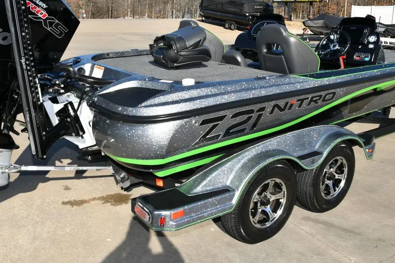 Slide: The Image of 2020 Nitro Z21 Pro boat with metallic finish and green accents on a trailer. - 6