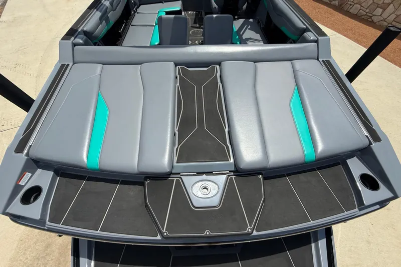 Slide: The Image of 2022 Axis T220 boat interior with gray and teal seating, modern design. - 4