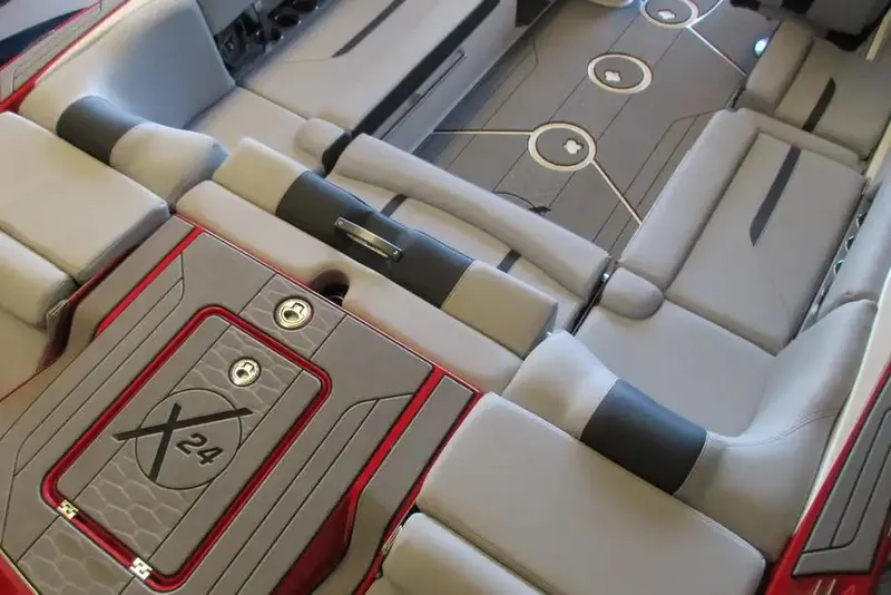 Slide: The Image of 2022 MasterCraft X24 boat interior with luxurious seating and modern design. - 3