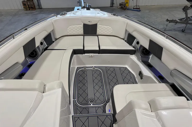 Slide: The Image of Luxurious interior of 2015 Chaparral 327 SSX boat with spacious seating and elegant design. - 11