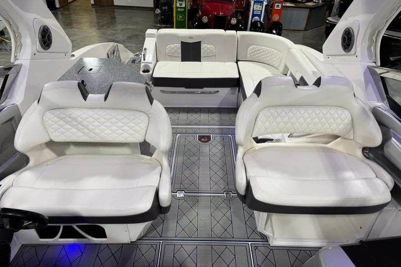 Slide: The Image of Luxurious interior of 2015 Chaparral 327 SSX boat with white leather seating and modern design. - 12