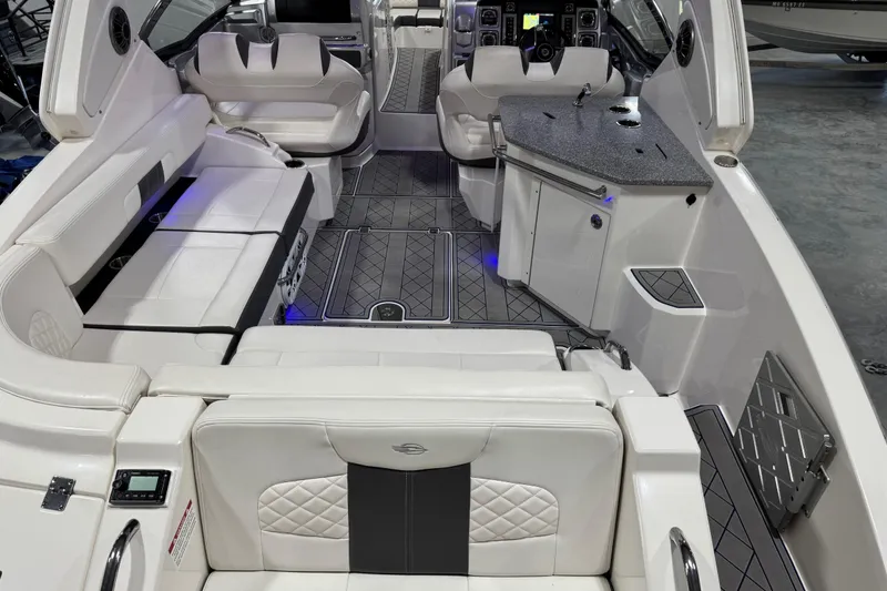 Slide: The Image of Luxurious interior of 2015 Chaparral 327 SSX boat with plush seating and modern amenities. - 6