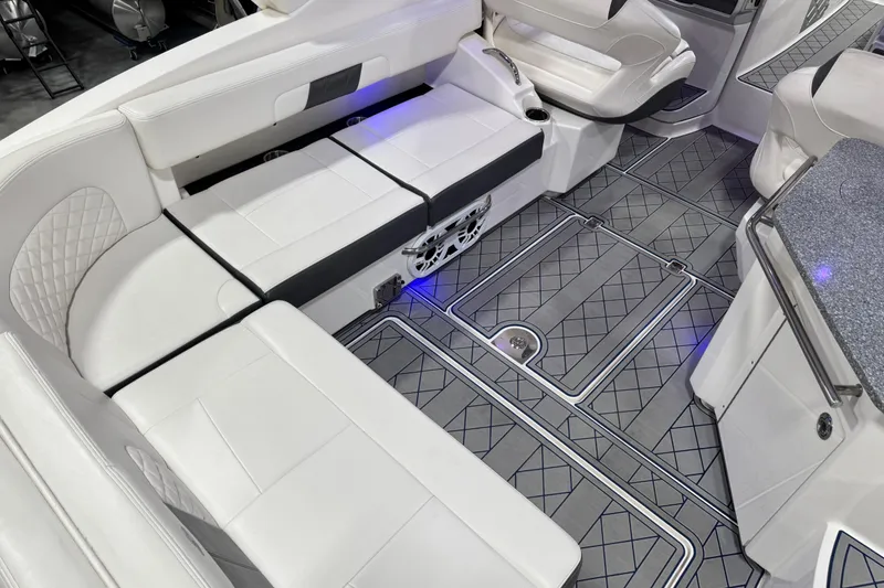 Slide: The Image of Luxurious interior of 2015 Chaparral 327 SSX boat with white seating and stylish flooring. - 8