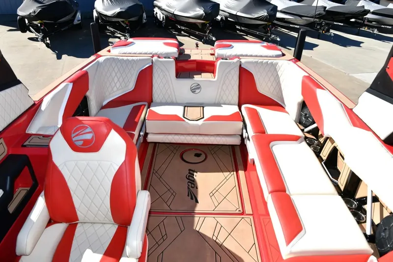 Slide: The Image of 2022 Tigé 24RZX boat interior with red and white seating, showcasing luxury design. - 12