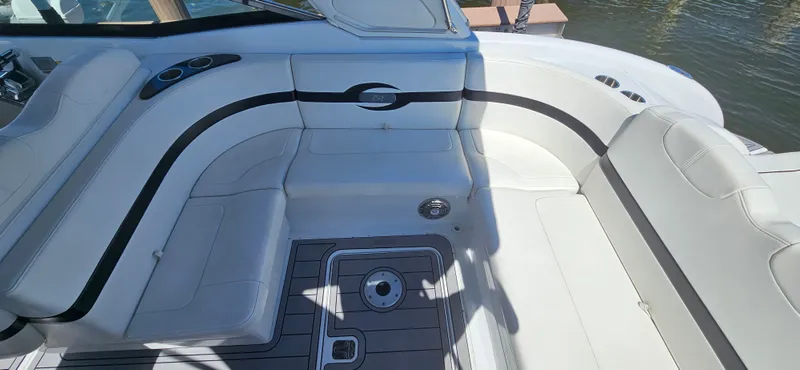 Slide: The Image of 2011 Formula 310 Bowrider interior with white seating and sleek design. - 12