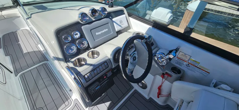 Slide: The Image of 2011 Formula 310 Bowrider dashboard with Raymarine display and modern controls. - 3