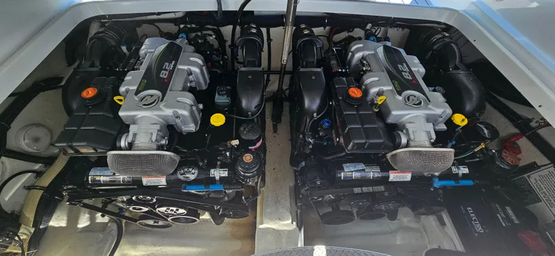 Slide: The Image of Twin engines in a 2011 Formula 310 Bowrider boat, showcasing powerful performance. - 6