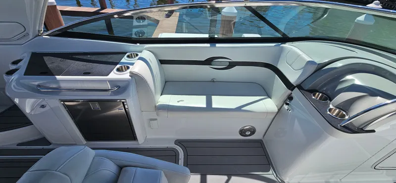 Slide: The Image of 2011 Formula 310 Bowrider interior with seating, helm, and sleek design. - 7